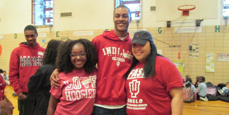 Three students in IU gear smiling for the camera.