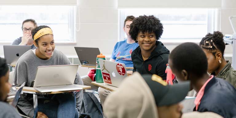 Students smiling during class. 