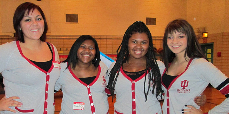 Four female students smiling.